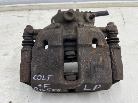 Zacisk hamulcowy Mitsubishi Colt VI 6 Z30 Smart Forfour I w454 04-12r. LEWE przednie jarzmo mocowanie lewy przód