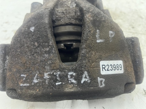 Zacisk hamulcowy Opel Zafira B 05-14r. Jarzmo Lewy przedni