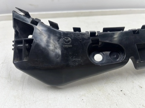 Ślizg Mazda 2 III DJ 14r- lewe przednie mocowanie wspornik uchwyt zderzaka d09h502j1