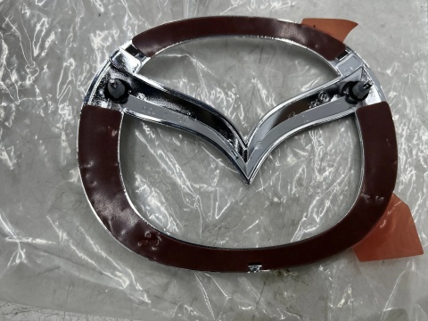Znaczek Mazda 2 DE 07-14r. znaczek emblemat na klapę bagażnika 110x140mm. ORYGNALNY D65151730