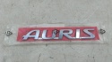 Znaczek Toyota Auris 2 II E18 E180 12-18r. NOWY napis AURIS emblemat logo na klapę bagażnika ORYGNALNY 75442-02140