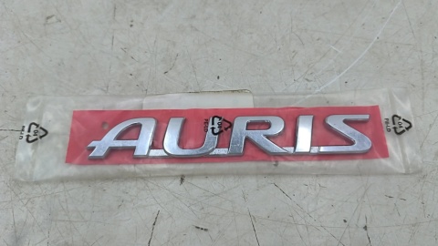 Znaczek Toyota Auris 2 II E18 E180 12-18r. NOWY napis AURIS emblemat logo na klapę bagażnika ORYGNALNY 75442-02140