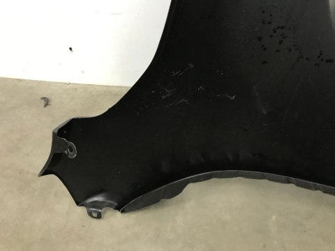 Błotnik Suzuki Grand Vitara 2 II 05-14r. lewy 57700-65810